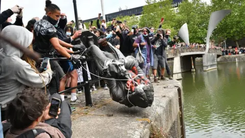 PA Media Protesters throw statue of Edward Colston into Bristol harbour
