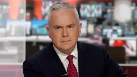Huw Edwards presenting the Ten O'clock News in the newly revamped flagship Studio B in New Broadcasting House, London. The studio will be home to the BBC News at Six and Ten, elections and other special programmes