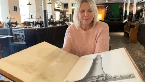 Leeds Museums and Galleries Abby Dix-Mason with the book