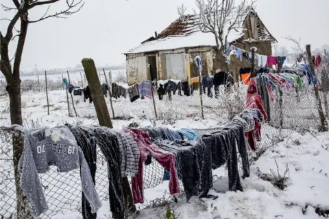 Toderici Remus Snow-covered clothes hanging to dry