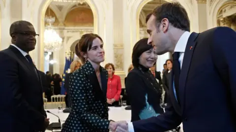 Getty Images Emma Watson and Emmanuel Macron