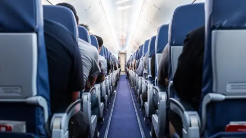 Getty Images The inside of a plane