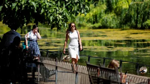 AFP People strolling through St James's Park