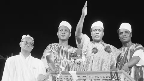 Getty Images Prime Minister Kwame Nkrumah (center) waves to celebrating crowd here March 6th after the British colony known as the Gold Coast ceased to exist and the sovereign state of Ghana came into being