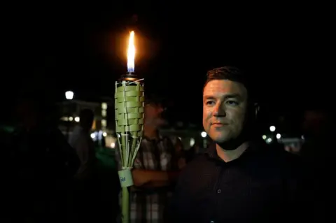 Getty Images Jason Kessler at the UVA campus torch march