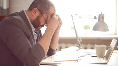 Getty Images Stressed worker