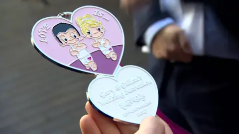 Special medal designed for Gary Connolly and Gillian Cordner's wedding marathon