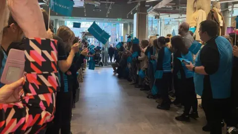 Staff at Bank Buildings formed a tunnel to welcome customers back into the premises