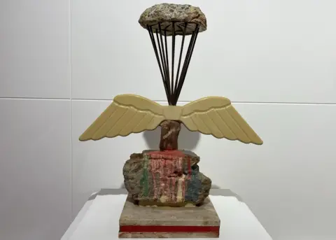 BBC Sculpture of paratrooper made from building materials