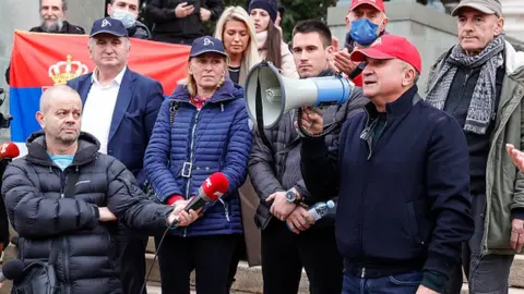 Getty Images The family of Novak Djokovic attend a rally in front of Serbia's National Assembly