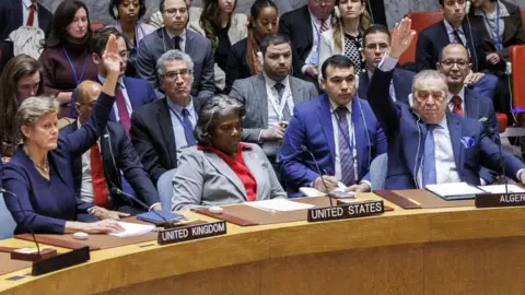 EPA Ambassadors, except for United States Ambassador Linda Thomas-Greenfield, raise their hands to vote in favour of a resolution calling for an immediate ceasefire in Gaza, during a United Nations Security Council meeting at the United Nations Headquarters in New York, USA, 25 March 2024.