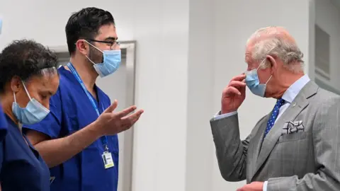 Glyn Kirk/PA Wire Prince Charles and NHS staff
