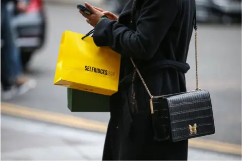 Getty Images Woman with shopping bag