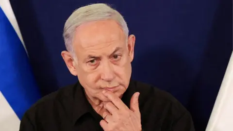 Reuters Benjamin Netanyahu during a press conference with a fingers on his lip