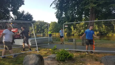 Fencing being erected at the riverside