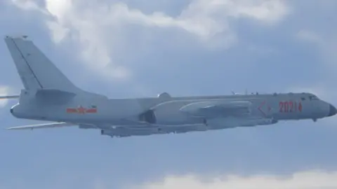 Reuters A Chinese H-6 bomber flies on a mission near the median line in the Taiwan Strait on 18 September 2020
