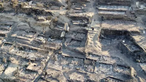 Reuters An aerial view of destroyed shelters following a fire at the Moria camp for refugees and migrants on the Island of Lesbos, Greece, 9 September 2020