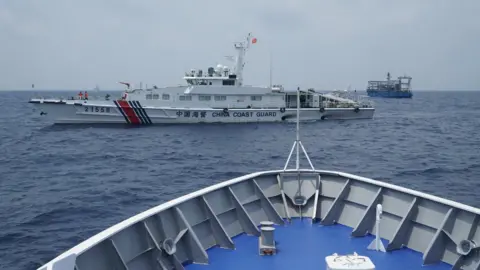 BBC/VIRMA SIMONNETTE China coast guard and militia ships as seen from Philippine coast guard ship