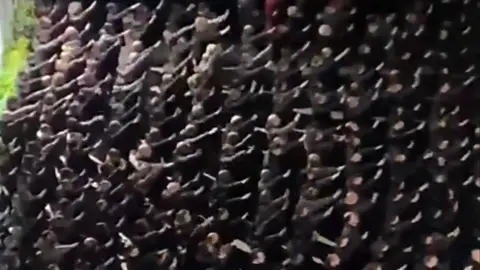 Paolo Berizzi/La Repubblica Hundreds of men given neo-fascist salutes in Rome