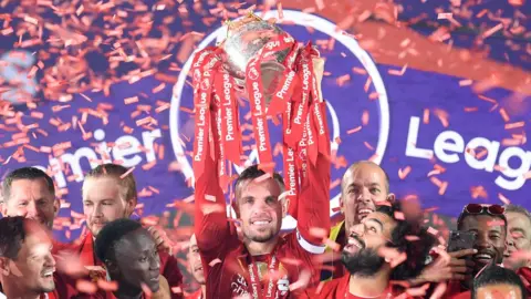 Getty Images Liverpool celebrate Premier League win