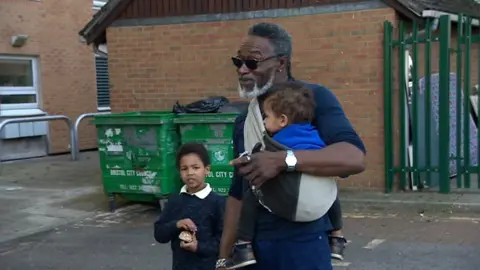 BBC Samuel with two of his children