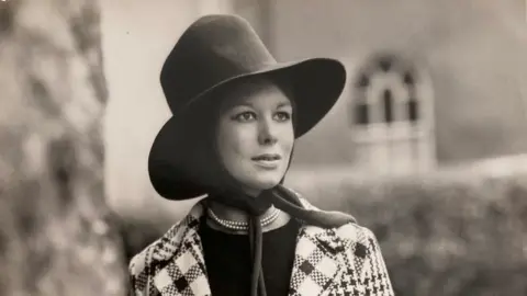 black and white photo of Melloney in a hat