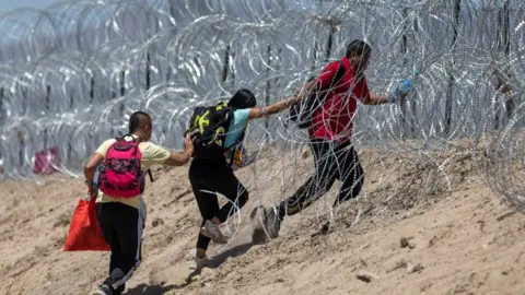 Getty Images Migrants at border