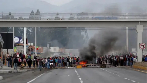 Reuters Protesters block a road