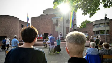 EPA-EFE Couples attend a blessing outside a Catholic church in Cologne