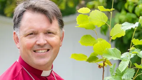 Church of England The Bishop of Norwich, Graham Usher