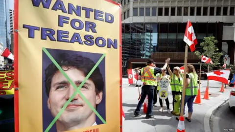 Reuters Yellow vest protesters at Calgary stampede