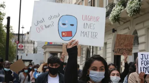 Getty Images People demonstrate against the treatment of Uighurs in Xinjiang, in front of the Chinese Embassy in London, UK, on 11 September 2020