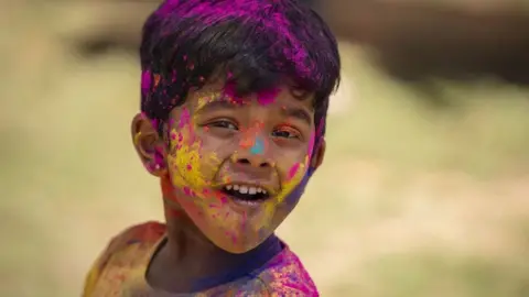 Getty Images People take part in the Holi Festival celebrations at Radhe Shyam Temple in Johannesburg, South Africa on March 11, 2023