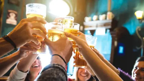 Getty Images Group of friends drinking