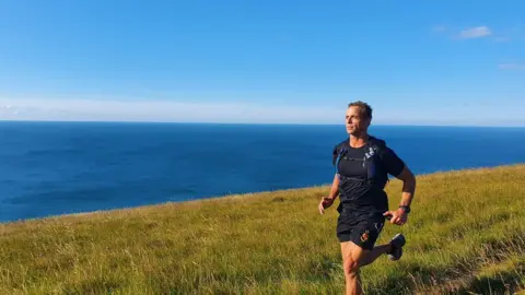 Paul Minter Paul Minter running by the sea