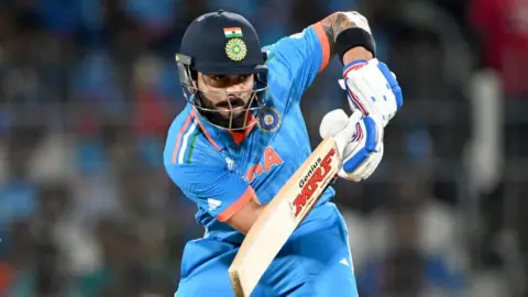 Getty Images India's Virat Kohli plays a shot during the 2023 ICC Men's Cricket World Cup one-day international (ODI) match between India and Australia at the MA Chidambaram Stadium in Chennai on October 8, 2023. (Photo by Punit PARANJPE / AFP) / -- IMAGE RESTRICTED TO EDITORIAL USE - STRICTLY NO COMMERCIAL USE -- (Photo by PUNIT PARANJPE/AFP via Getty Images)