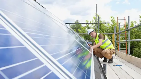 Getty Images solar panel fitter