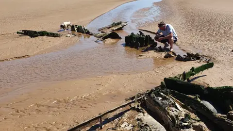 Debi Hartley  Wreckage on beach