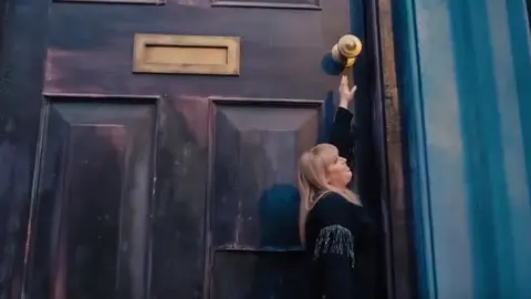 Universal Rebel Wilson and the giant door