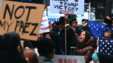 Getty Images Protesters clash outside Trump Tower in New York after the 2016 election.