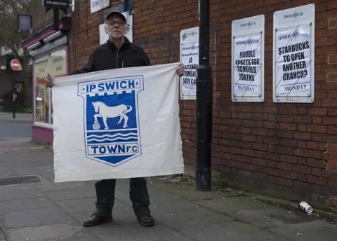 Julian Germain / PhotoEast Andrew Kerrison with his home-made banner