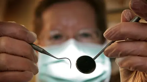 Peter Macdiarmid/Getty Images Dentist