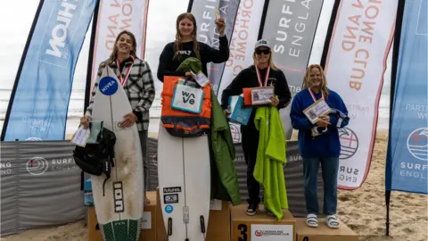 Surfing England Winner Lauren Sandland, second left, with Lucy Campbell, left, Lily Pierce and Charlotte Mulley