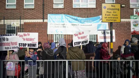 Getty Images Protesters outside Parkfield Community School on 21 March
