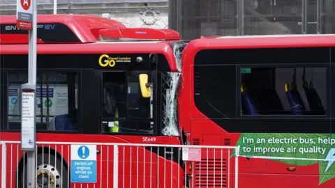 Ian West/PA Bus crashed into another