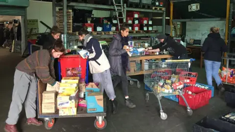 Aid workers sort through supplies