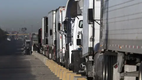 AFP/Getty Trucks line up to cross the border with the United States at Otay Mesa Commercial Port of Entry in Tijuana, Mexico on January 22, 2018.