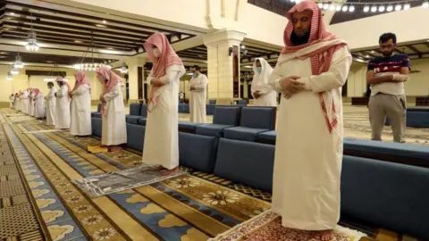 Reuters Muslims perform prayers inside the Al-Rajhi Mosque while practicing social distancing in Saudi Arabia