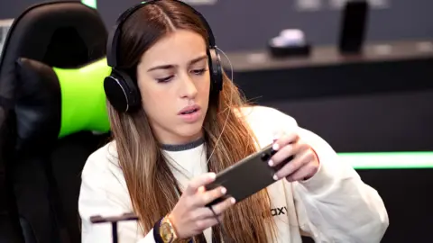 Getty Images Woman uses Samsung phone