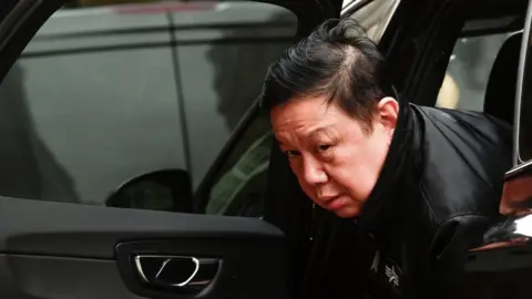 Reuters Kyaw Zwar Minn getting out of a car looking very tired